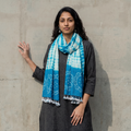 Blue Handwoven Tie-Dye Merino Wool Shibori & Bandhani stole, worn by a woman, AI visual of the stole, iTokri