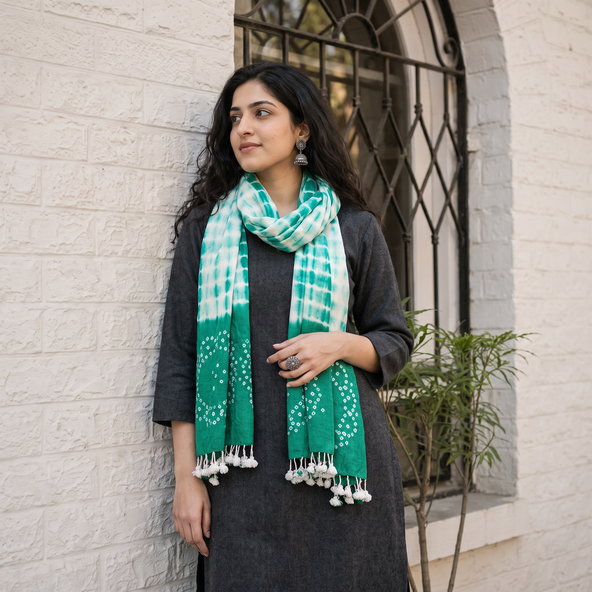 Green Handwoven Tie-Dye Merino Wool Shibori & Bandhani stole, worn by a woman, AI visual of the stole, iTokri