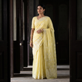 Yellow Heavy Hand Embroidered Terivoile Cotton Lucknow Chikan Saree, draped and worn by a woman, AI visual of the saree, iTokri