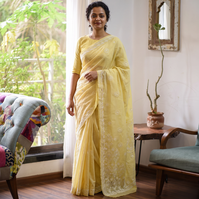 Yellow Heavy Hand Embroidered Terivoile Cotton Lucknow Chikan Saree, draped and worn by a woman, AI visual of the saree, iTokri