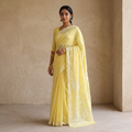 Yellow Heavy Hand Embroidered Terivoile Cotton Lucknow Chikan Saree, draped and worn by a woman, AI visual of the saree, iTokri