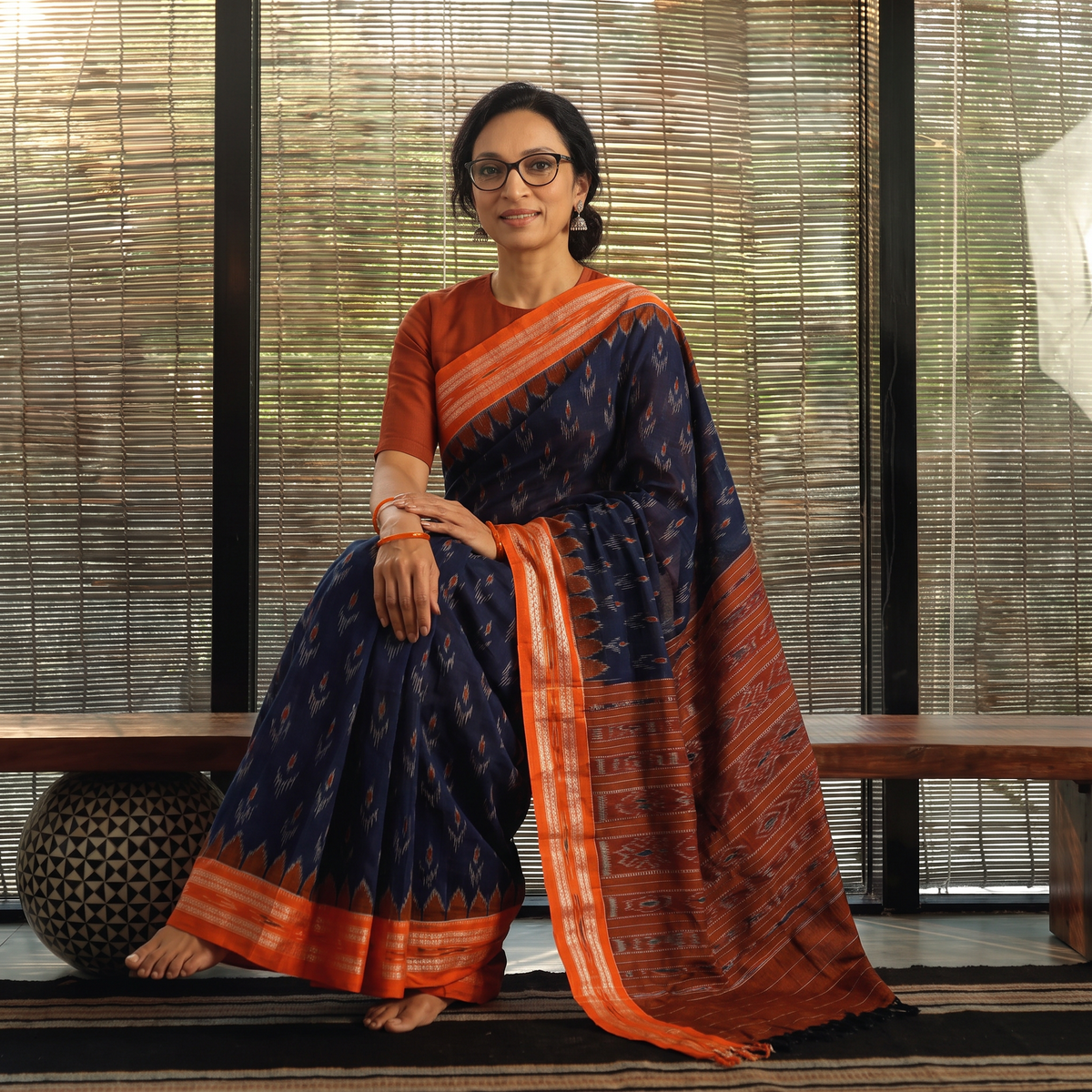 Blue Ikat Handloom Cotton Sambalpuri Saree, draped and worn by a woman, AI visual of the saree, iTokri