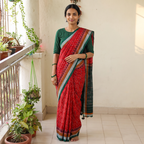 Red Ikat Handloom Cotton Sambalpuri Saree, draped and worn by a woman, AI visual of the saree, iTokri