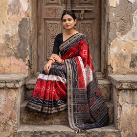 Red Ikat Handloom Cotton Sambalpuri Saree, draped and worn by a woman, AI visual of the saree, iTokri