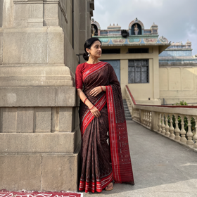Brown Ikat Handloom Cotton Sambalpuri Saree, draped and worn by a woman, AI visual of the saree, iTokri