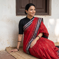 Red Ikat Handloom Cotton Sambalpuri Saree, draped and worn by a woman, AI visual of the saree, iTokri