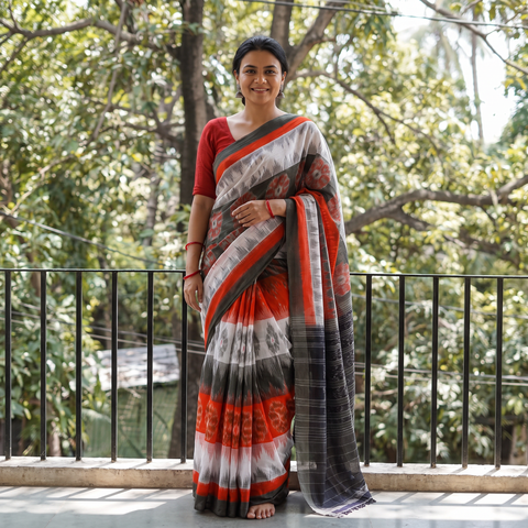 Multicolor Ikat Handloom Cotton Sambalpuri Saree, draped and worn by a woman, AI visual of the saree, iTokri