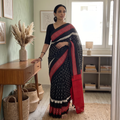 Black Ikat Handloom Cotton Sambalpuri Saree, draped and worn by a woman, AI visual of the saree, iTokri