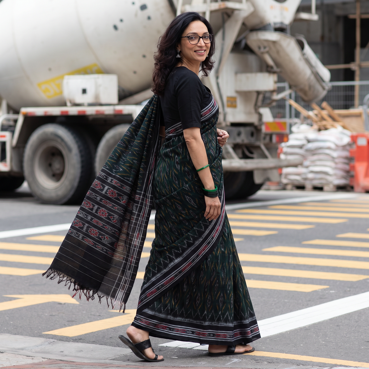 Green Ikat Handloom Cotton Sambalpuri Saree, draped and worn by a woman, AI visual of the saree, iTokri