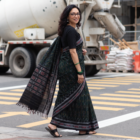 Green Ikat Handloom Cotton Sambalpuri Saree, draped and worn by a woman, AI visual of the saree, iTokri