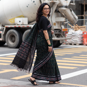Green Ikat Handloom Cotton Sambalpuri Saree, draped and worn by a woman, AI visual of the saree, iTokri