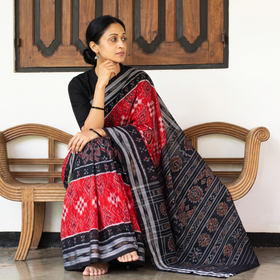 Red Ikat Handloom Cotton Sambalpuri Saree, draped and worn by a woman, AI visual of the saree, iTokri