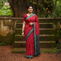Red Ikat Handloom Cotton Sambalpuri Saree, draped and worn by a woman, AI visual of the saree, iTokri