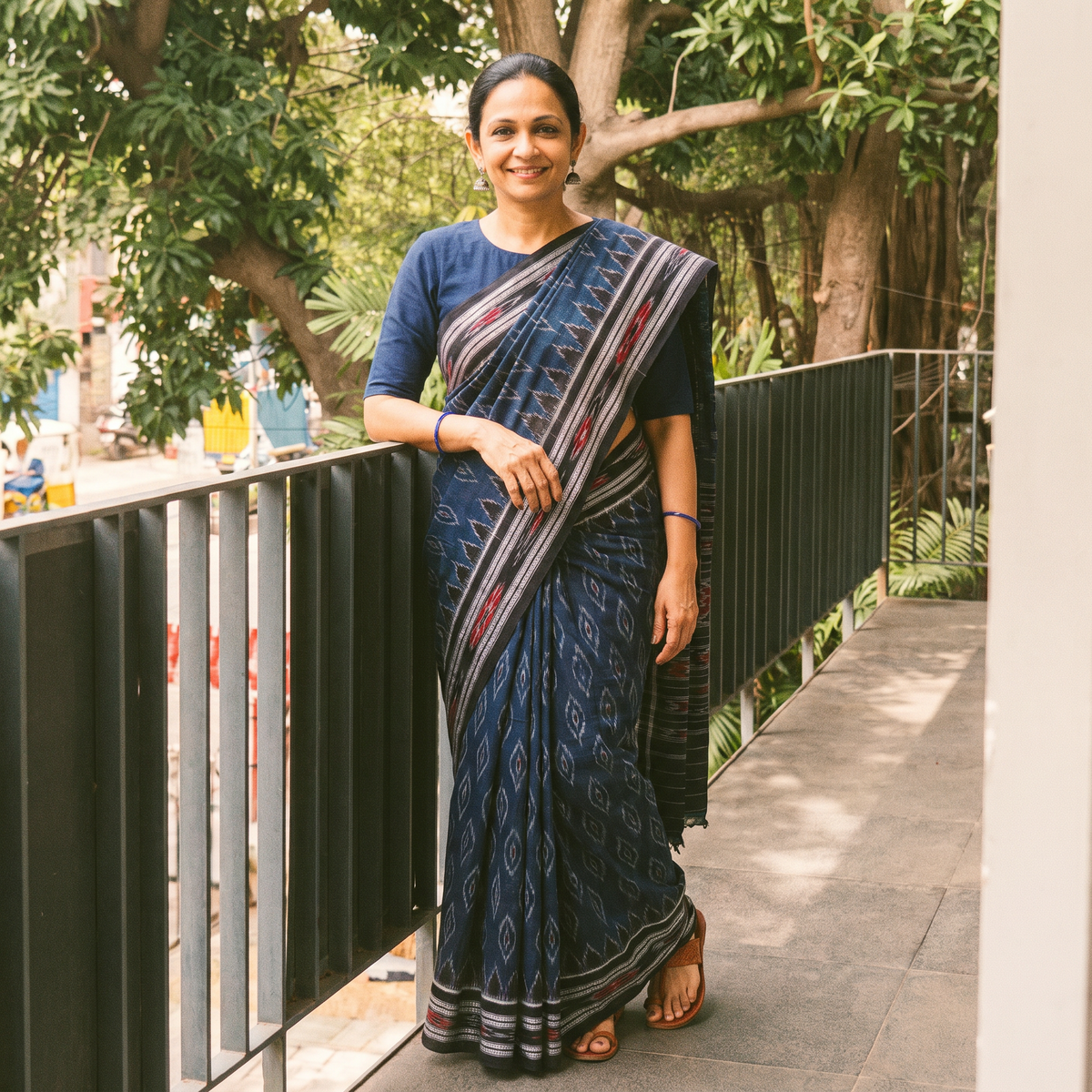 Blue Ikat Handloom Cotton Sambalpuri Saree, draped and worn by a woman, AI visual of the saree, iTokri