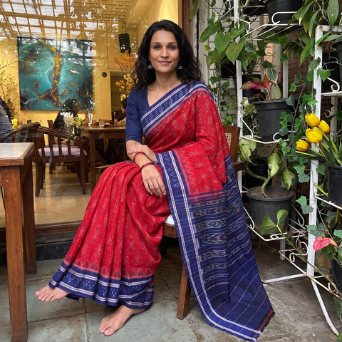 Red Ikat Handloom Cotton Sambalpuri Saree, draped and worn by a woman, AI visual of the saree, iTokri