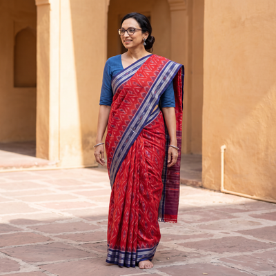 Red Ikat Handloom Cotton Sambalpuri Saree, draped and worn by a woman, AI visual of the saree, iTokri