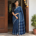 Blue Indigo block printed linen handloom Sanganeri saree, draped and worn by a woman, AI visual of the saree, iTokri