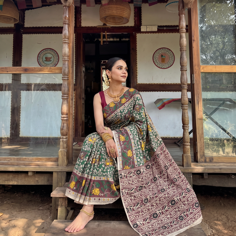 Green Kalamkari Printed Cotton Saree, draped and worn by a woman, AI visual of the saree, iTokri