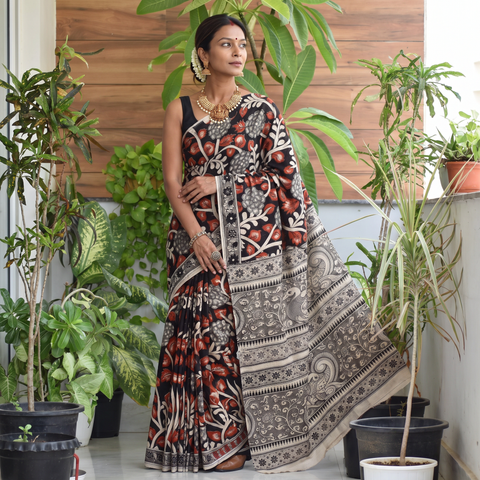 Black Kalamkari Printed Cotton Saree, draped and worn by a woman, AI visual of the saree, iTokri