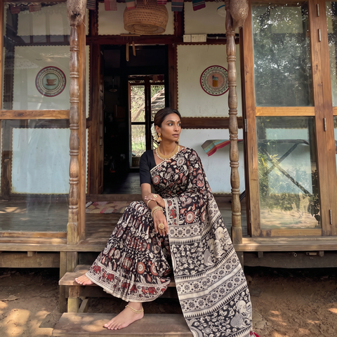 Black Kalamkari Printed Cotton Saree, draped and worn by a woman, AI visual of the saree, iTokri