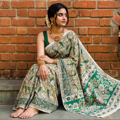 Green Kalamkari Printed Cotton Saree, draped and worn by a woman, AI visual of the saree, iTokri