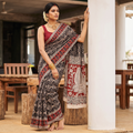 Black Kalamkari Printed Cotton Saree, draped and worn by a woman, AI visual of the saree, iTokri