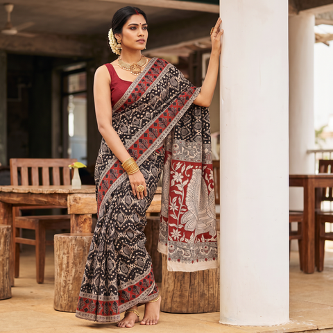 Black Kalamkari Printed Cotton Saree, draped and worn by a woman, AI visual of the saree, iTokri