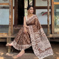 Brown Kalamkari Printed Cotton Saree, draped and worn by a woman, AI visual of the saree, iTokri