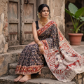 Black Kalamkari Printed Cotton Saree, draped and worn by a woman, AI visual of the saree, iTokri