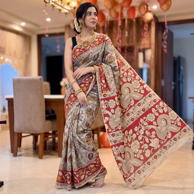 Beige Kalamkari Printed Cotton Saree, draped and worn by a woman, AI visual of the saree, iTokri