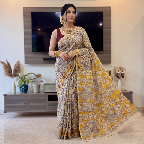 Beige Kalamkari Printed Cotton Saree, draped and worn by a woman, AI visual of the saree, iTokri