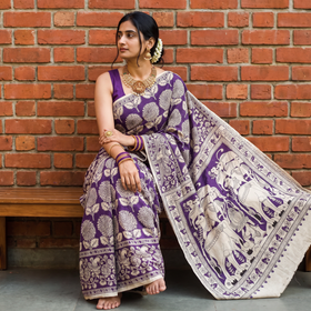Beige Kalamkari Printed Cotton Saree, draped and worn by a woman, AI visual of the saree, iTokri