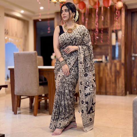Beige Kalamkari Printed Cotton Saree, draped and worn by a woman, AI visual of the saree, iTokri