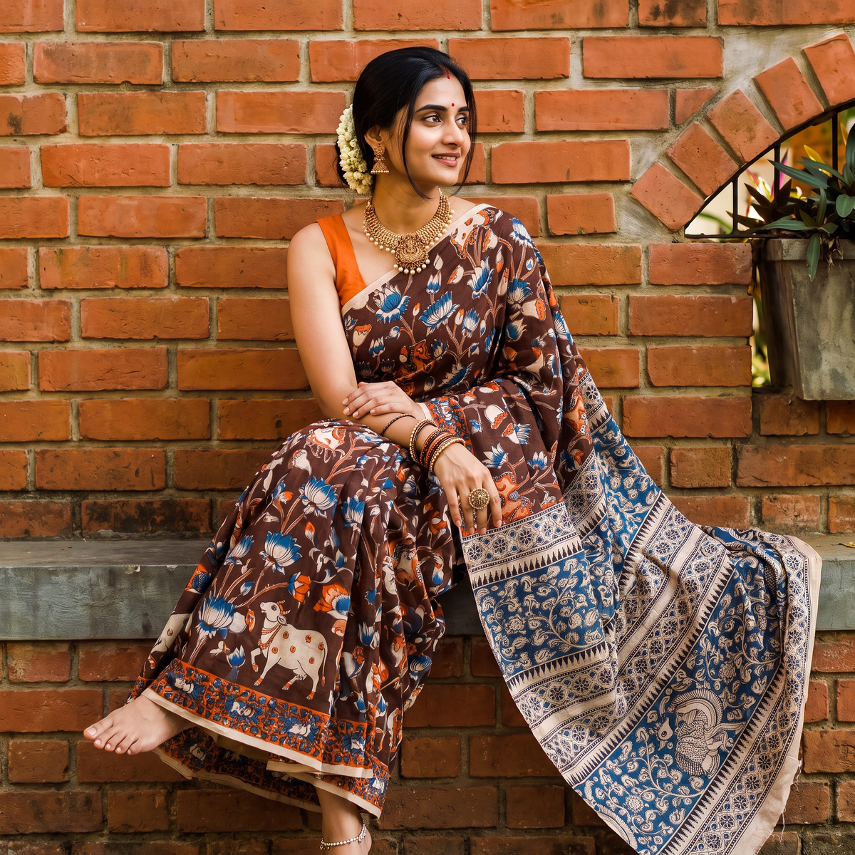 Brown Kalamkari Printed Cotton Saree, draped and worn by a woman, AI visual of the saree, iTokri