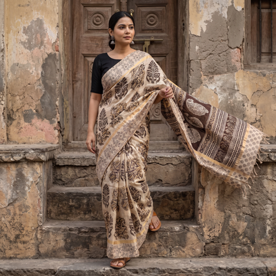 Beige Kalamkari Printed Silk Cotton Saree with Zari Border, draped and worn by a woman, AI visual of the saree, iTokri