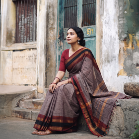 Purple Kanchipuram Buti Cotton Saree with Border, draped and worn by a woman, AI visual of the saree, iTokri