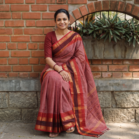 Pink Kanchipuram Buti Cotton Saree with Border, draped and worn by a woman, AI visual of the saree, iTokri