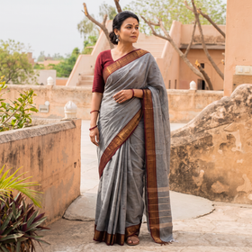 Grey Kanchipuram Buti Cotton Saree with Border, draped and worn by a woman, AI visual of the saree, iTokri