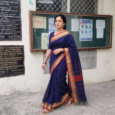 Blue Kanchipuram Cotton Saree with Thread Border, draped and worn by a woman, AI visual of the saree, iTokri