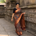 Black Kanjeevaram Pure Handloom Mulberry Silk Handpainted Srikalahasti Pen Kalamkari Saree with Zari Work, draped and worn by a woman, AI visual of the saree, iTokri