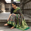 Black Kanjeevaram Pure Handloom Mulberry Silk Handpainted Srikalahasti Pen Kalamkari Saree with Zari Work, draped and worn by a woman, AI visual of the saree, iTokri