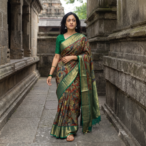 Red Kanjeevaram Pure Handloom Mulberry Silk Handpainted Srikalahasti Pen Kalamkari Saree with Zari Work, draped and worn by a woman, AI visual of the saree, iTokri