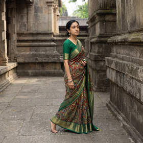 Red Kanjeevaram Pure Handloom Mulberry Silk Handpainted Srikalahasti Pen Kalamkari Saree with Zari Work, draped and worn by a woman, AI visual of the saree, iTokri