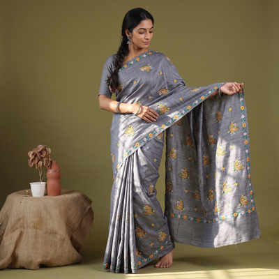 Grey Kashidakari Hand Embroidery Ghicha Tussar Silk Saree, draped and worn by a woman, AI visual of the saree, iTokri