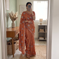 Orange Kashidakari Hand Embroidery Ghicha Tussar Silk Saree, draped and worn by a woman, AI visual of the saree, iTokri
