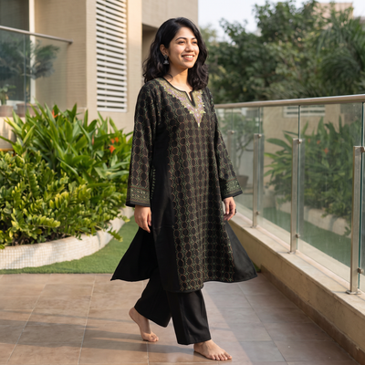 Black Kashmiri Heavy Sozni Hand Embroidered Handwoven Merino Wool Pheran, worn by a model, AI visual of the pheran, iTokri