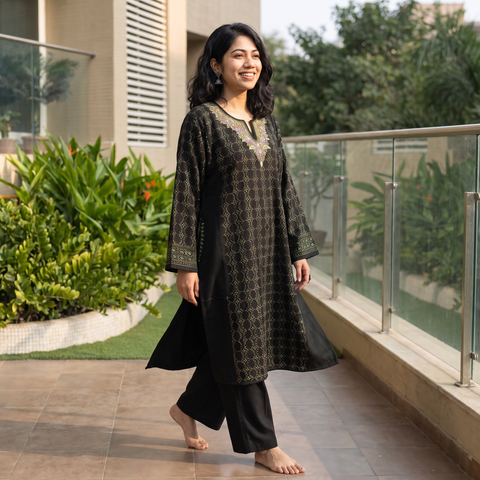 Black Kashmiri Heavy Sozni Hand Embroidered Handwoven Merino Wool Pheran, worn by a model, AI visual of the pheran, iTokri