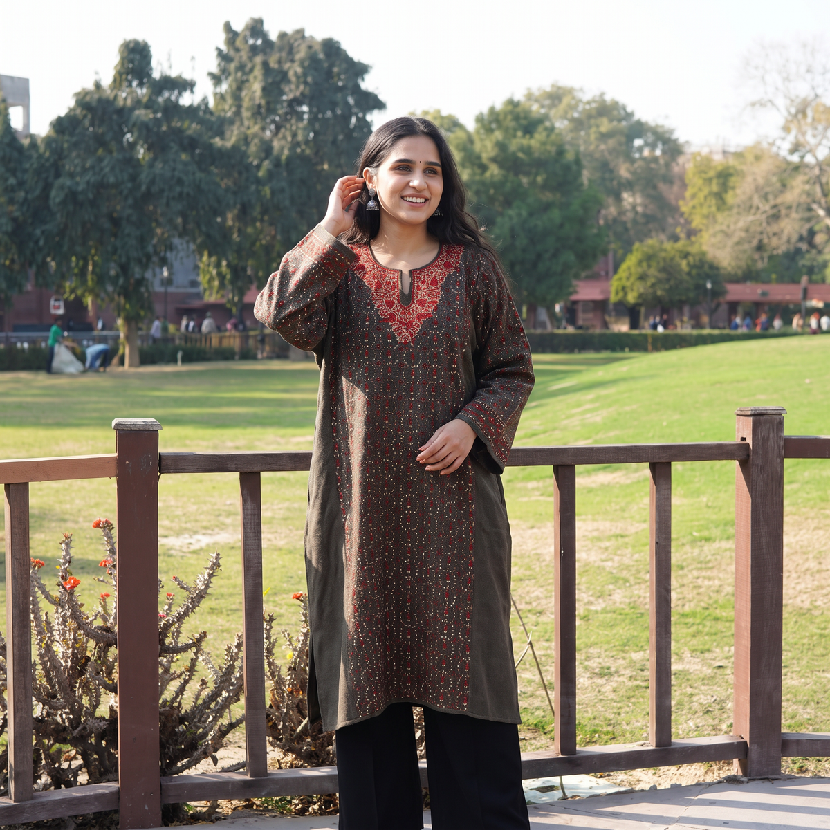 Brown Kashmiri Heavy Sozni Hand Embroidered Handwoven Merino Wool Pheran, worn by a model, AI visual of the pheran, iTokri