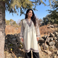 White Kashmiri Heavy Sozni Hand Embroidered Handwoven Merino Wool Pheran, worn by a model, AI visual of the pheran, iTokri