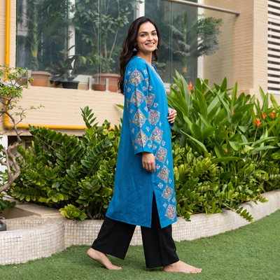 Blue Kashmiri Heavy Sozni Hand Embroidered Handwoven Merino Wool Pheran, worn by a model, AI visual of the pheran, iTokri